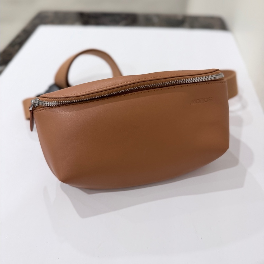 Faux leather woman’s cross body brown sling bag